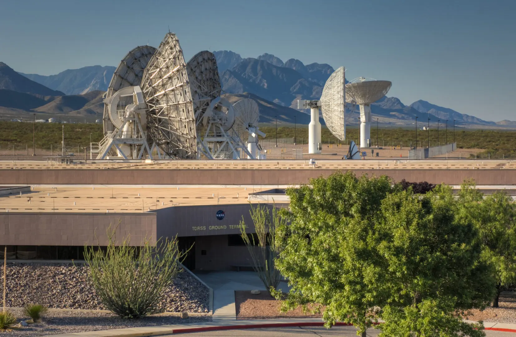 A view of some satellite dishes in the desert.